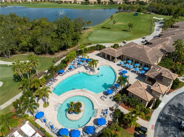 an aerial view of a house swimming pool and outdoor space