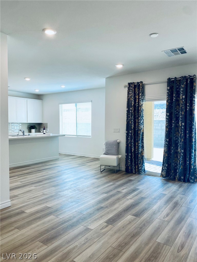 4457 Sawyer Ridge Street Las Vegas, NV 89147 - Photo 6 of 32 This bright, open-concept living space features durable flooring and direct outdoor access.