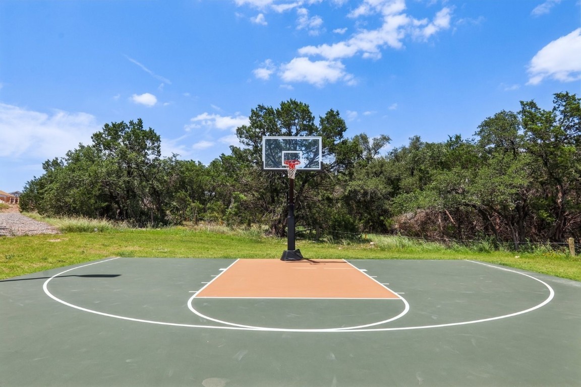 1220 Lavender Way Georgetown, TX 78628 - Photo 23 of 27 a tennis court with trees in the background