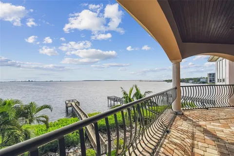 a kitchen with lots of counter top space and wooden floor