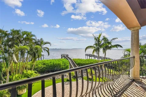 a kitchen with sink stove and refrigerator