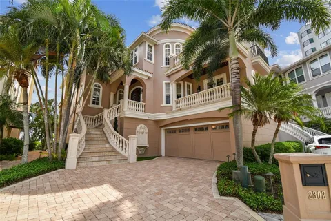 a bathroom with a granite countertop toilet sink and mirror