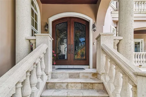 a view of a dining room with furniture wooden floor and chandelier