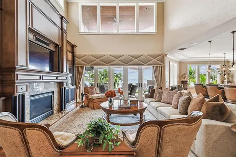 a view of a hallway with furniture and windows