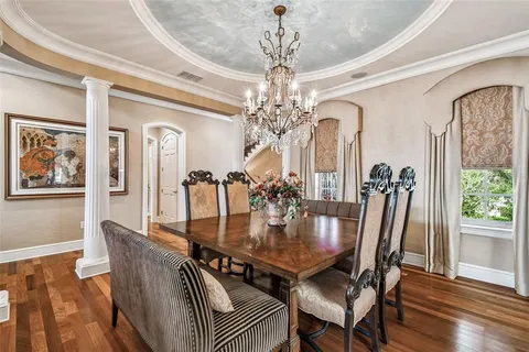 an aerial view of multiple houses with a yard