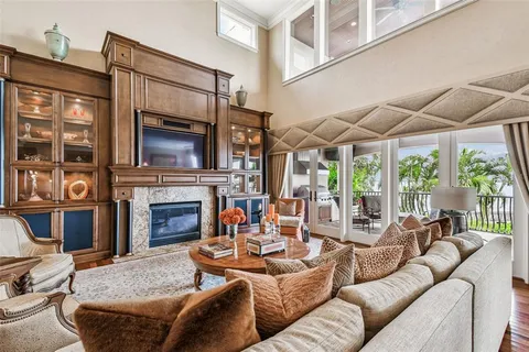 a view of a living room with furniture and clothes
