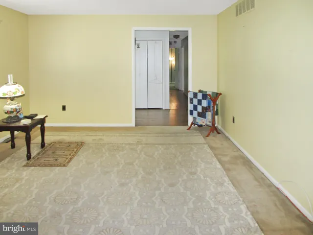 a kitchen with a refrigerator and a sink