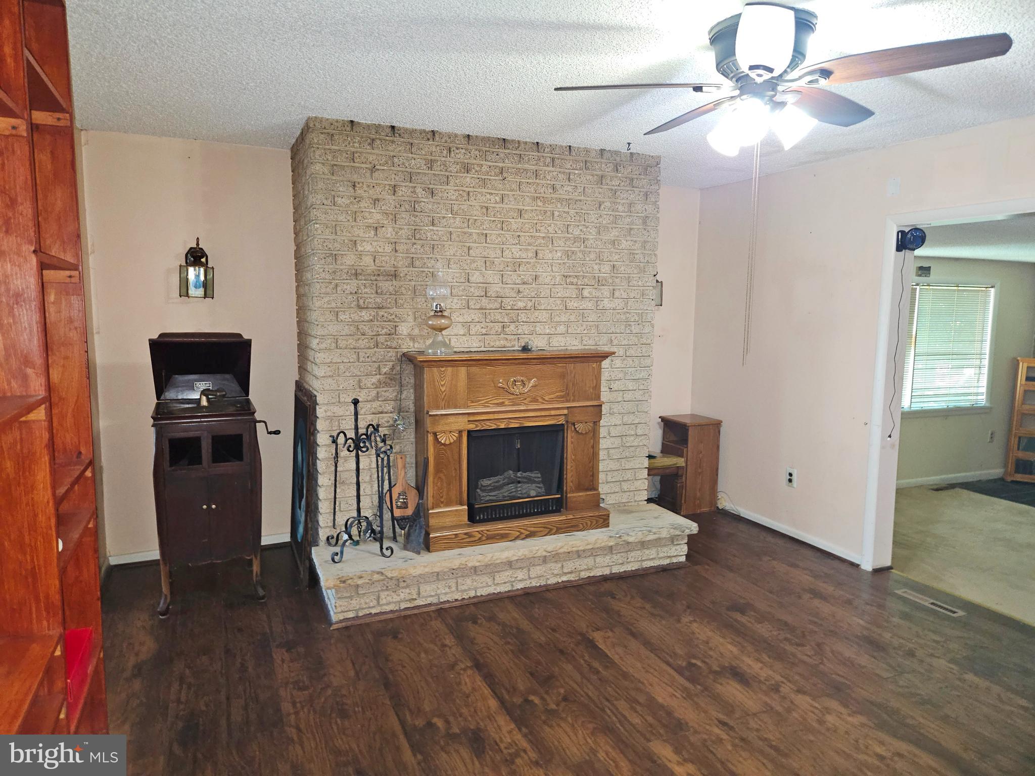 0 Maple Avenue Waterford Works, NJ 08089 - Photo 27 of 62 a living room with a fireplace and wooden floor