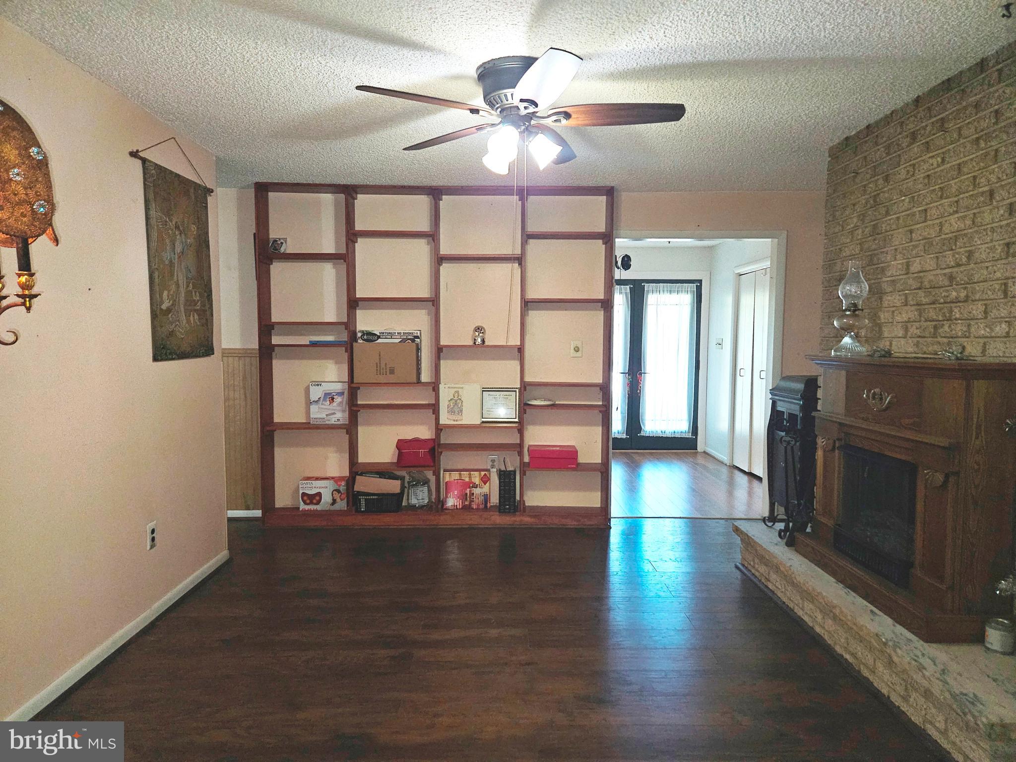 0 Maple Avenue Waterford Works, NJ 08089 - Photo 28 of 62 a view of a livingroom with furniture chandelier fan and a fireplace