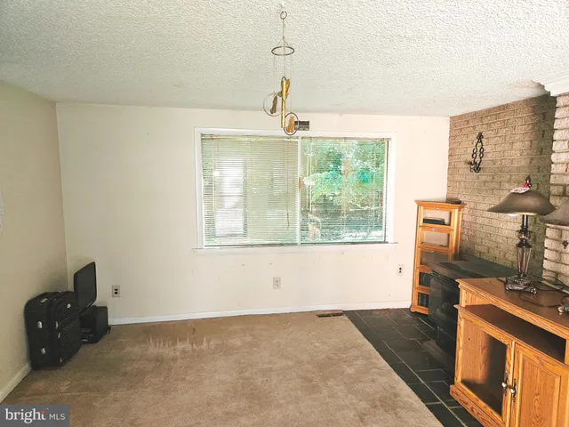 an empty room with wooden floor and closet