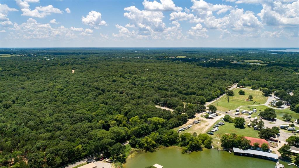 2 County Road 3706 Quinlan, TX 75474 - Photo 9 of 11 an aerial view of a houses with outdoor space and trees all around
