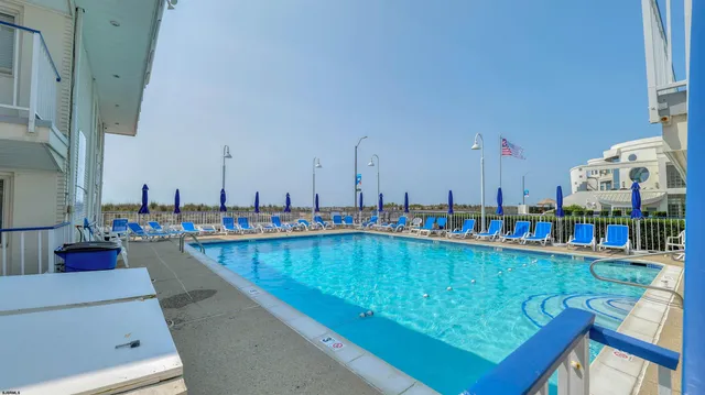 a view of a swimming pool with chairs