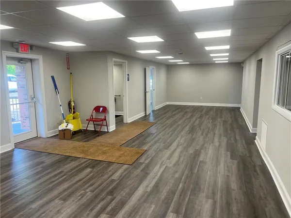 a view of a room with wooden floor and stairs