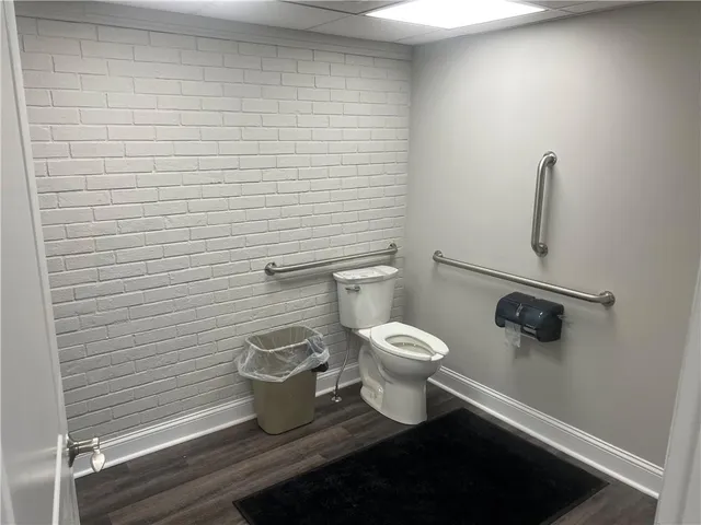 a bathroom with a toilet and a sink