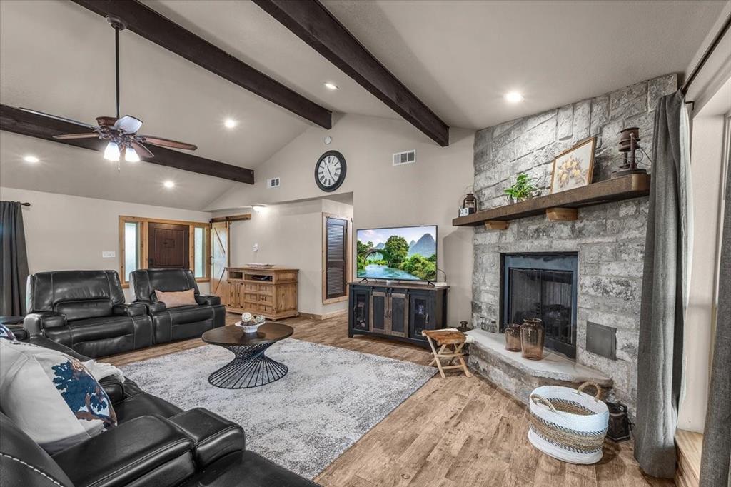 1508 Poolville Cut Off Road Poolville, TX 76487 - Photo 11 of 39 Living room featuring recessed lighting and cedar beams