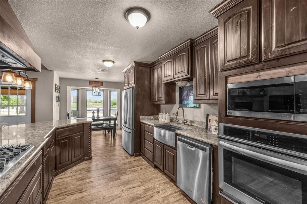 1508 Poolville Cut Off Road Poolville, TX 76487 - Photo 15 of 39 Kitchen with stainless steel appliances
