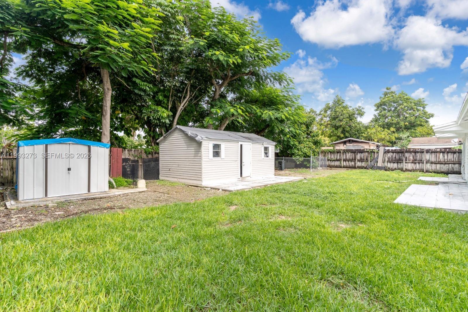 30534 Southwest 155th Court Homestead, FL 33033 - Photo 15 of 33 a view of a house with a yard and a large tree