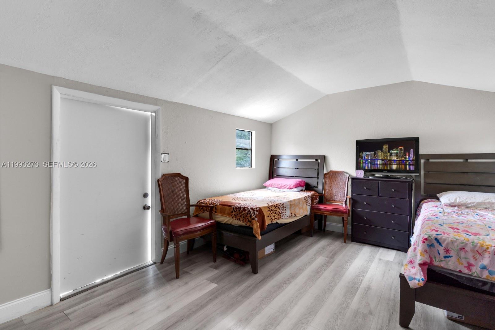 30534 Southwest 155th Court Homestead, FL 33033 - Photo 16 of 33 a bedroom with a bed and a closet