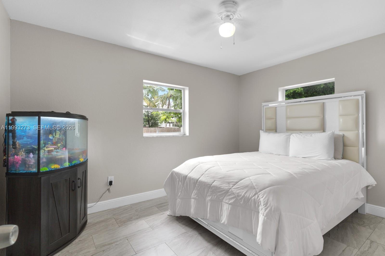 30534 Southwest 155th Court Homestead, FL 33033 - Photo 17 of 33 a bedroom with a bed and a window