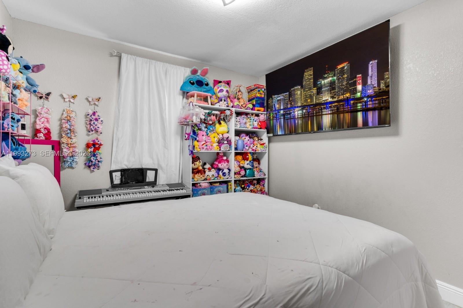 30534 Southwest 155th Court Homestead, FL 33033 - Photo 21 of 33 a bedroom with bed and a white cabinet