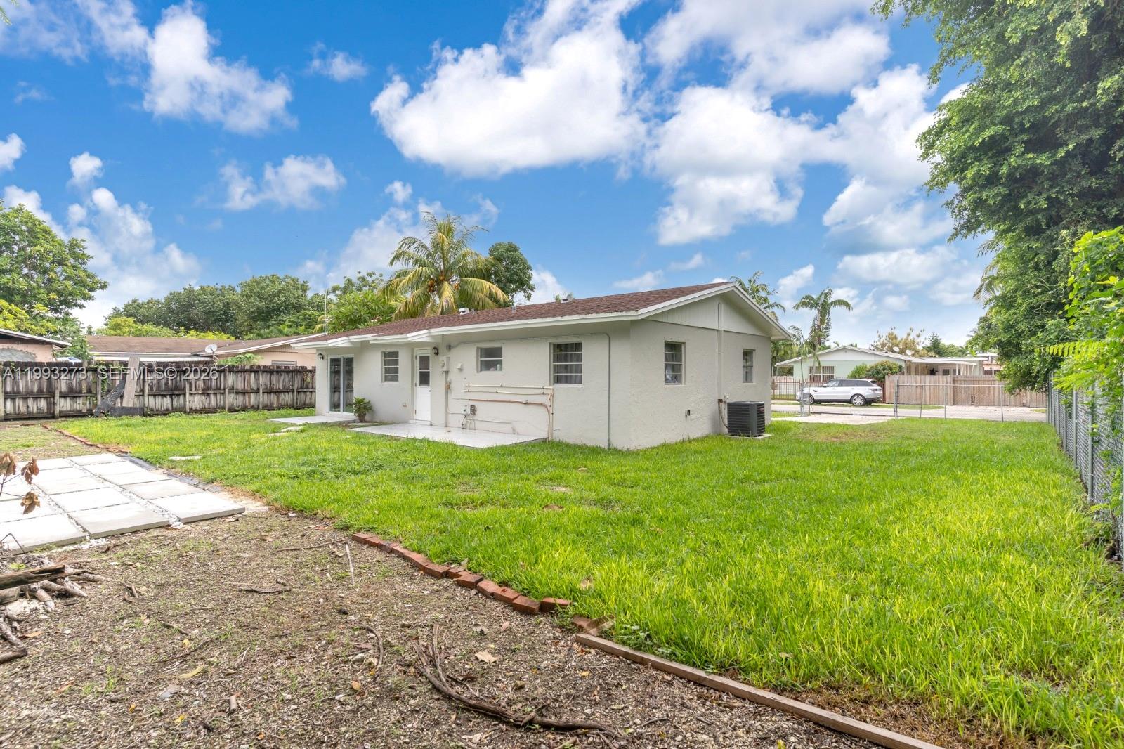 30534 Southwest 155th Court Homestead, FL 33033 - Photo 22 of 33 a view of a house with backyard and garden