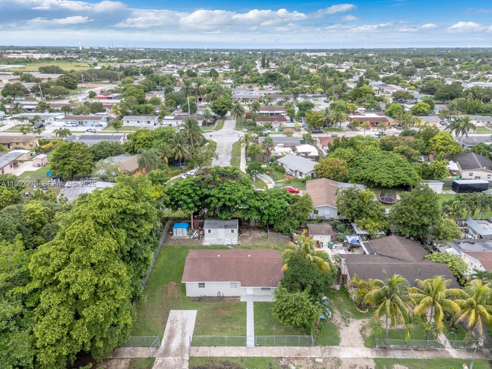 30534 Southwest 155th Court Homestead, FL 33033 - Photo 30 of 33 an aerial view of residential houses with outdoor space and trees