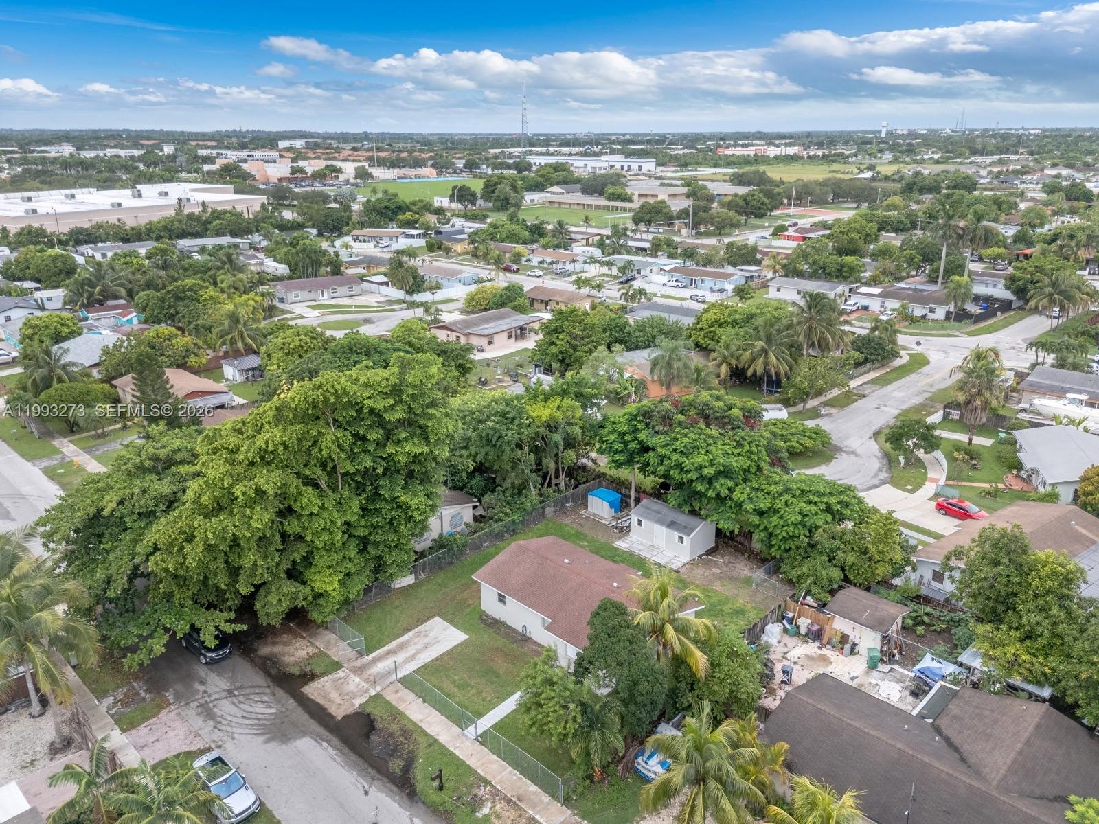 30534 Southwest 155th Court Homestead, FL 33033 - Photo 32 of 33 an aerial view of residential houses with outdoor space and trees