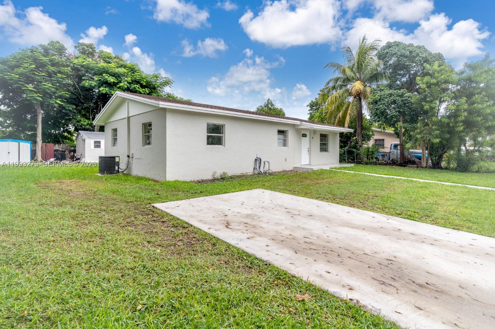 30534 Southwest 155th Court Homestead, FL 33033 - Photo 4 of 33 a front view of house with yard and green space