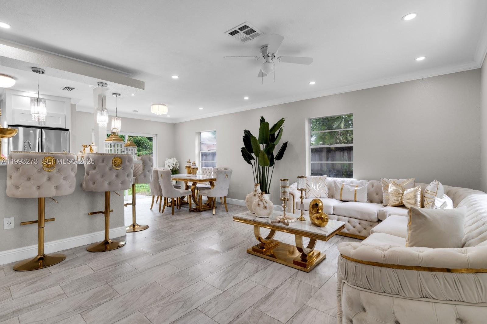 30534 Southwest 155th Court Homestead, FL 33033 - Photo 6 of 33 a living room with furniture and a dining table with wooden floor