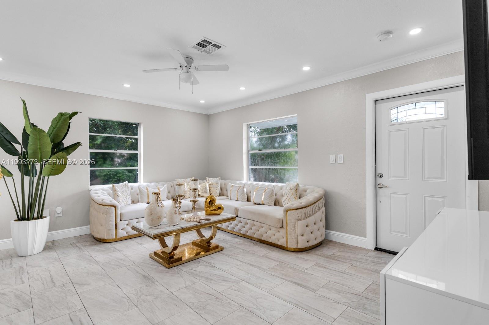 30534 Southwest 155th Court Homestead, FL 33033 - Photo 7 of 33 a living room with furniture and a large window