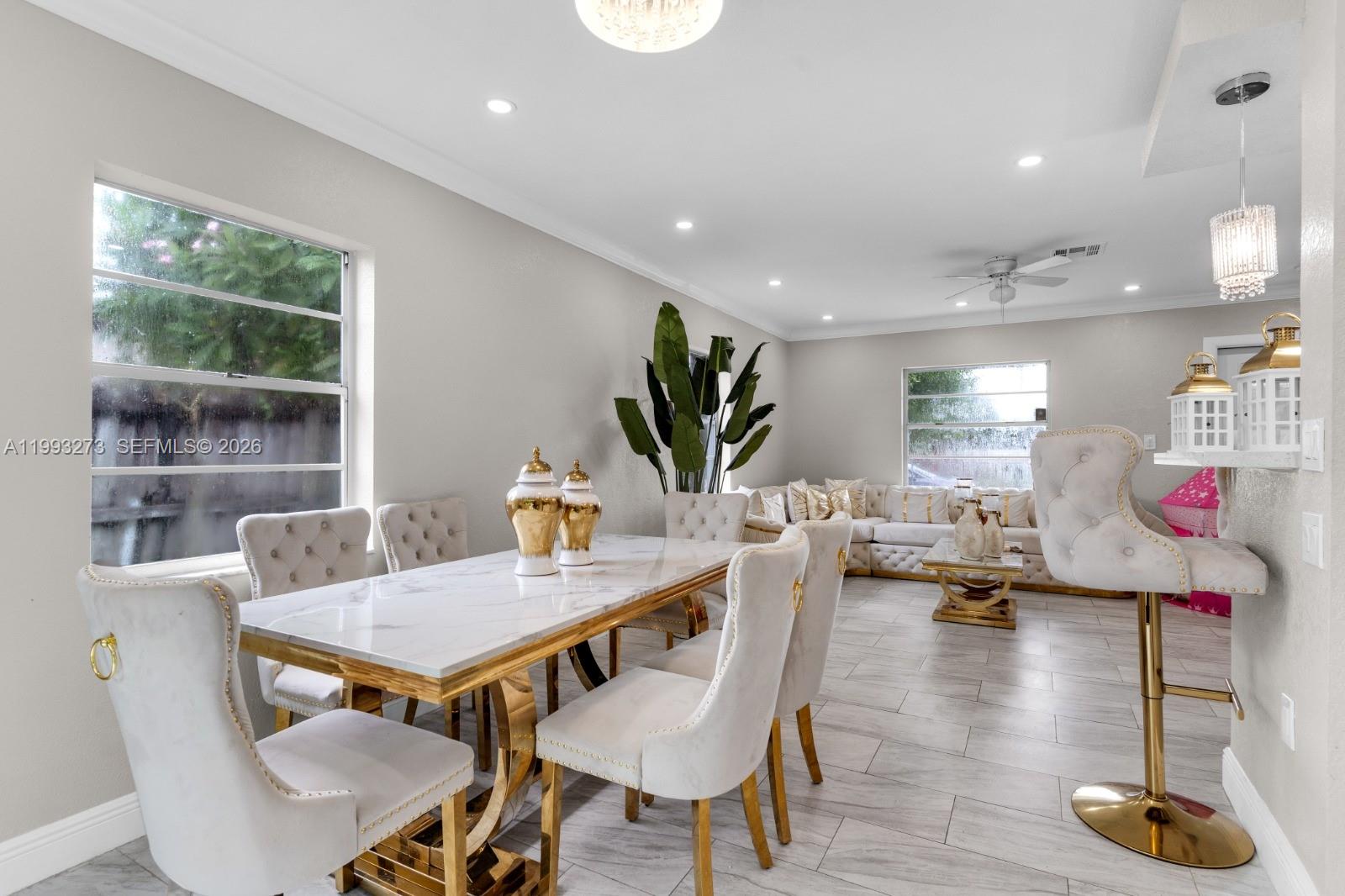 30534 Southwest 155th Court Homestead, FL 33033 - Photo 9 of 33 a view of a dining room with furniture window and wooden floor