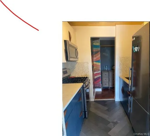 a kitchen with a stove and a refrigerator