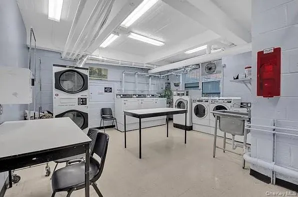 a living room with furniture and a clock