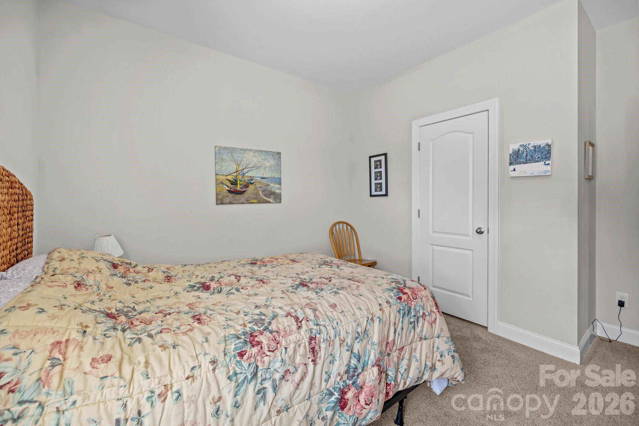 4697 Rinaldo Road York, SC 29745 - Photo 21 of 37 a bedroom with a bed and a painting on the wall