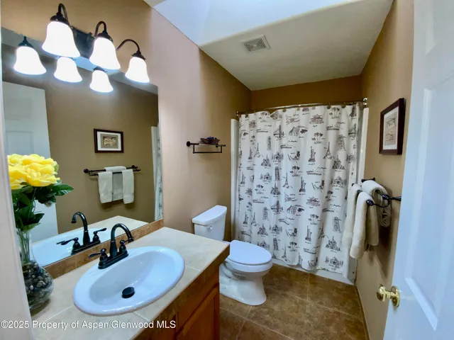 a view of a livingroom with furniture and a window