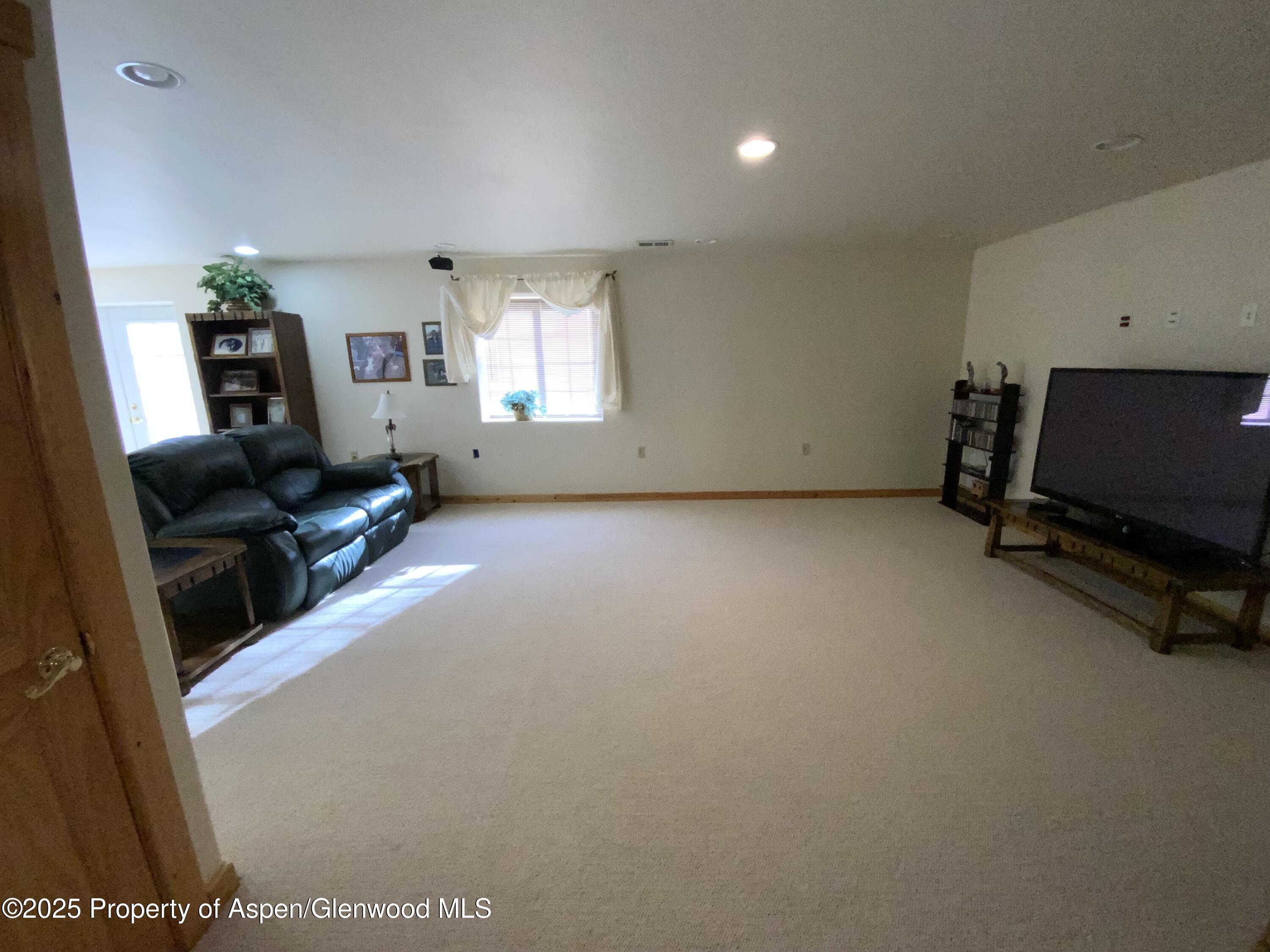 660 Aspen Avenue Rifle, CO 81650 - Photo 17 of 30 a view of a livingroom with furniture and a window