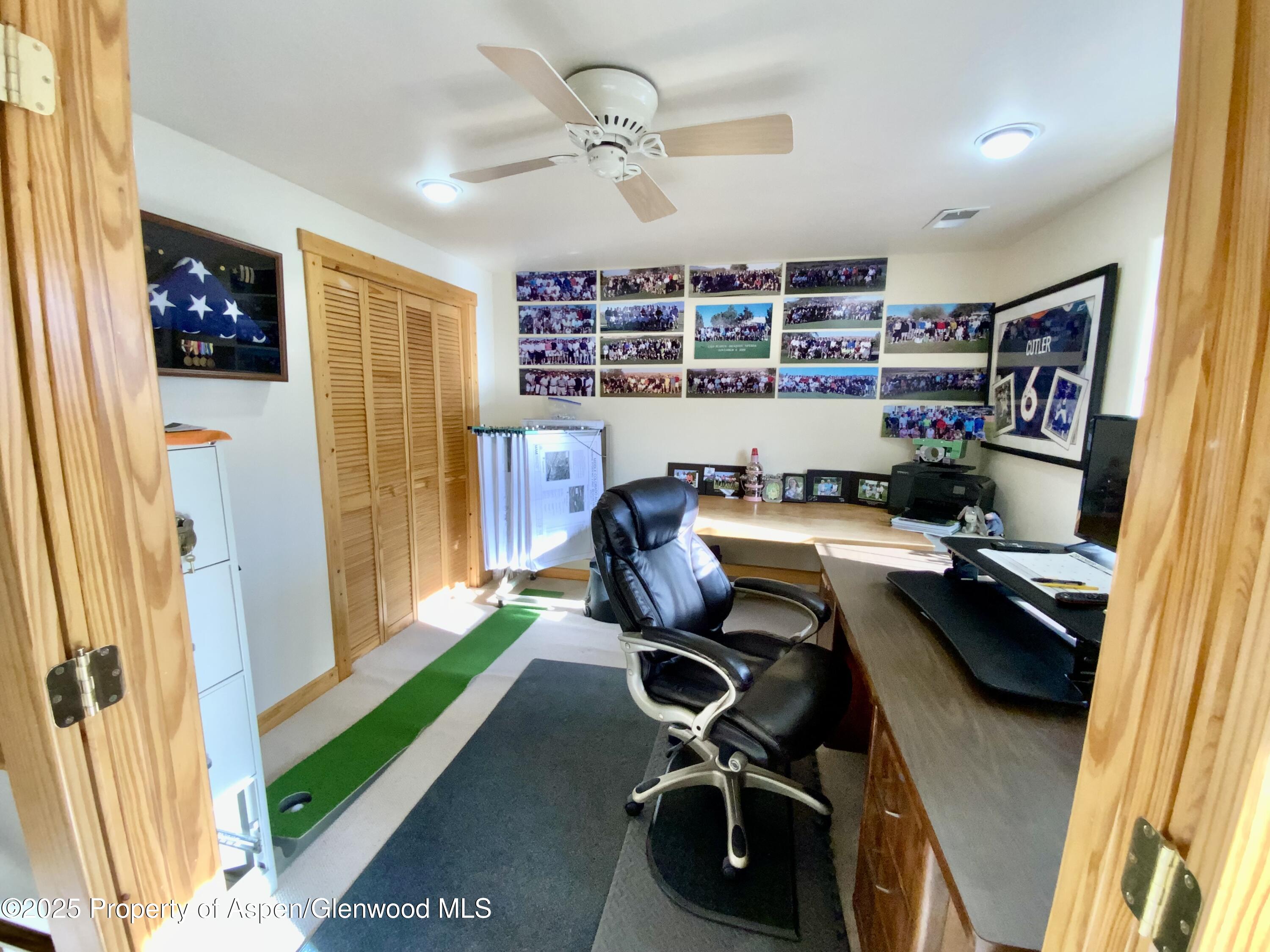 660 Aspen Avenue Rifle, CO 81650 - Photo 19 of 30 a view of a workspace with furniture and a window