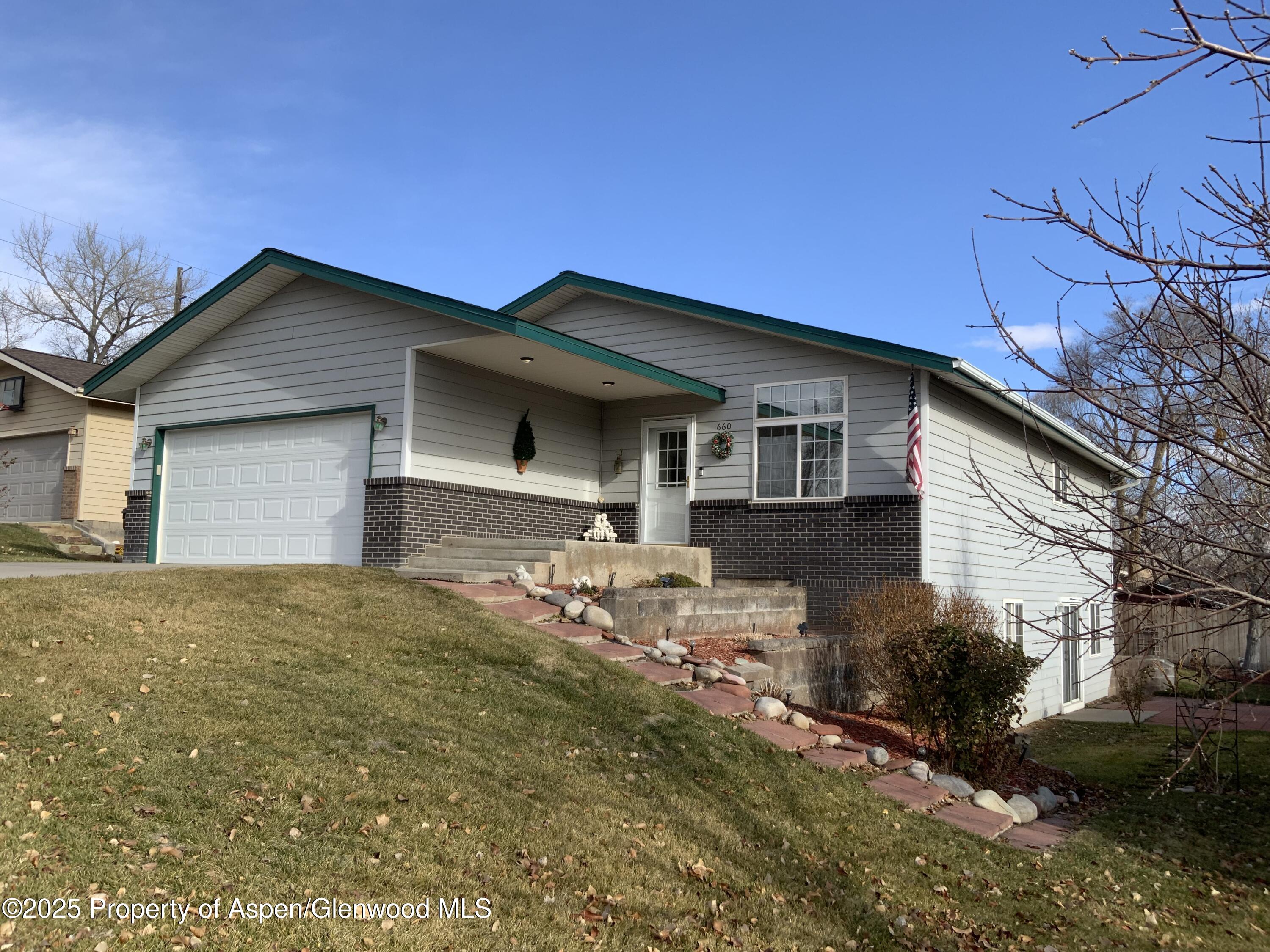 660 Aspen Avenue Rifle, CO 81650 - Photo 2 of 30 a backyard of a house with table and chairs