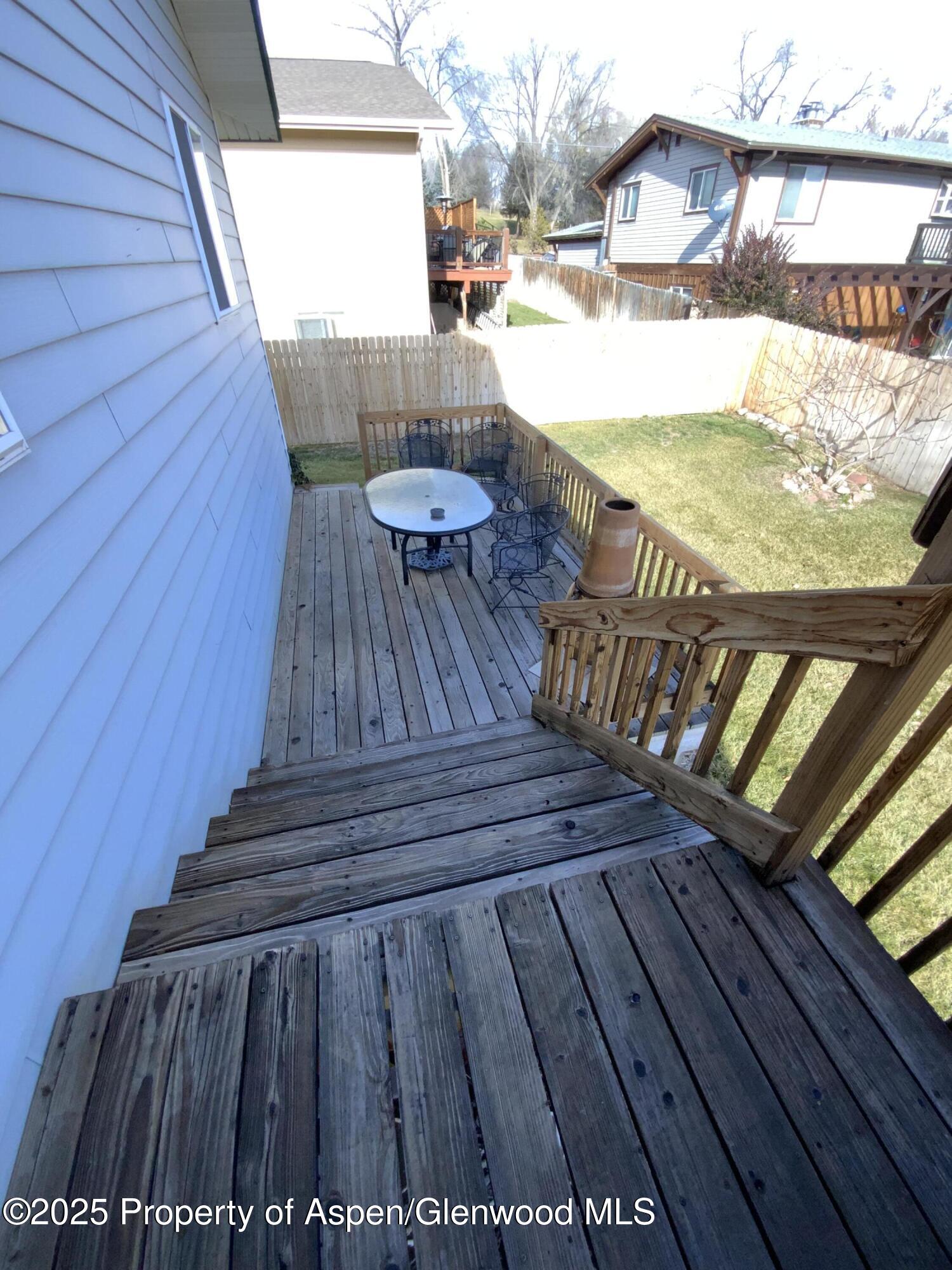 660 Aspen Avenue Rifle, CO 81650 - Photo 21 of 30 a view of a wooden deck with furniture
