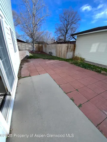 a view of balcony with wooden floor and outdoor seating