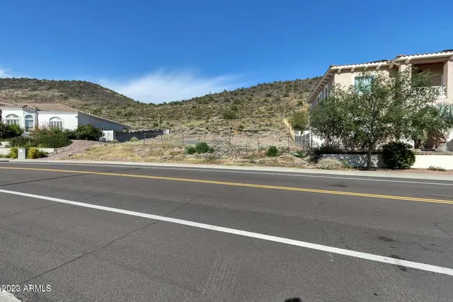 a view of a street with a building in the background