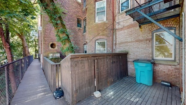 149 Winthrop Road, Unit 2 Brookline, MA 02445 - Photo 11 of 11 a view of a house with wooden fence