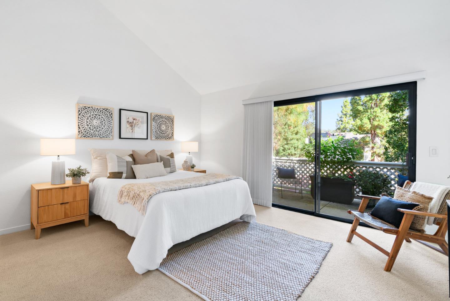 2615 Willowbrook Lane, Unit 82 Aptos, CA 95003 - Photo 11 of 27 a bedroom with a bed and a large window