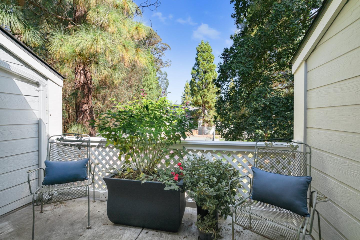 2615 Willowbrook Lane, Unit 82 Aptos, CA 95003 - Photo 15 of 27 a view of chair and tables in the back yard of the house