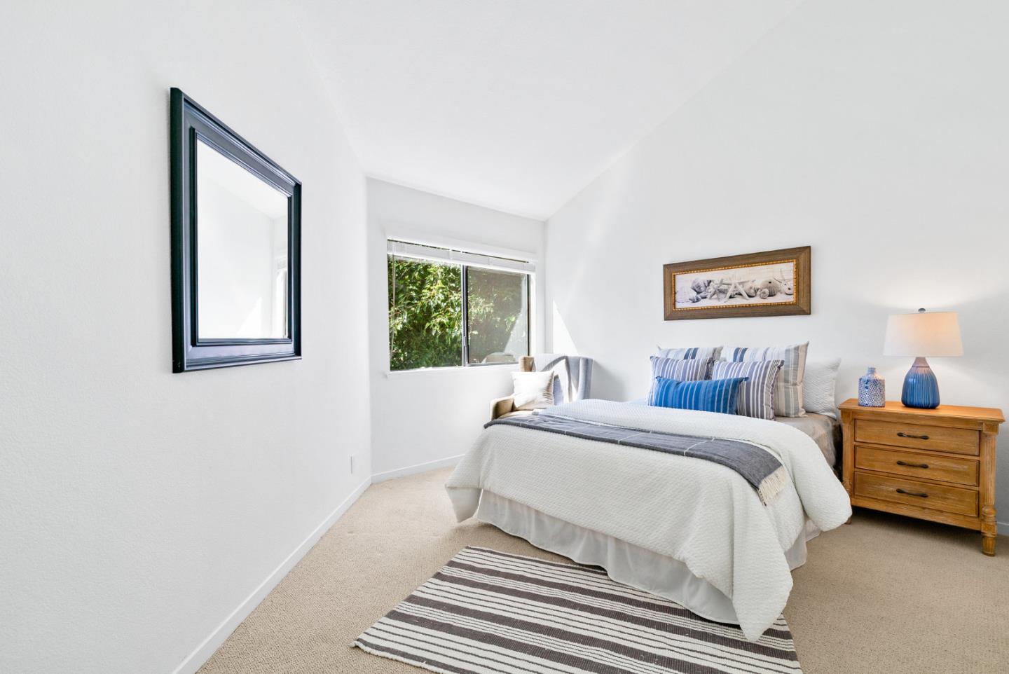 2615 Willowbrook Lane, Unit 82 Aptos, CA 95003 - Photo 20 of 27 a bed room with a bed and a window