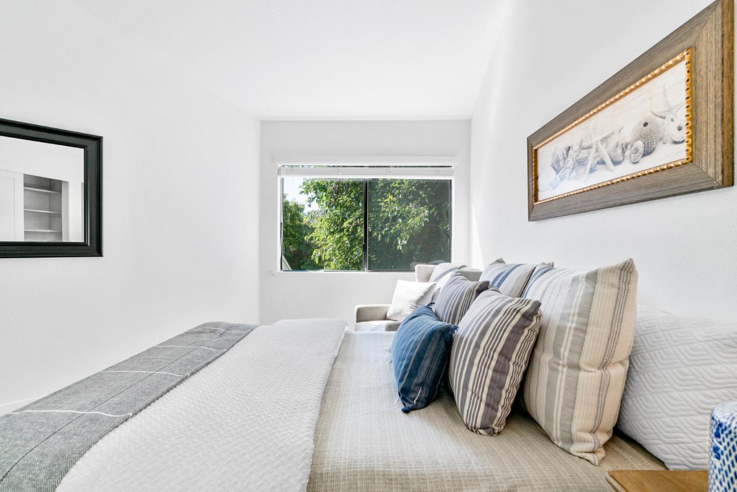 2615 Willowbrook Lane, Unit 82 Aptos, CA 95003 - Photo 21 of 27 a bed sitting in a bedroom next to a window