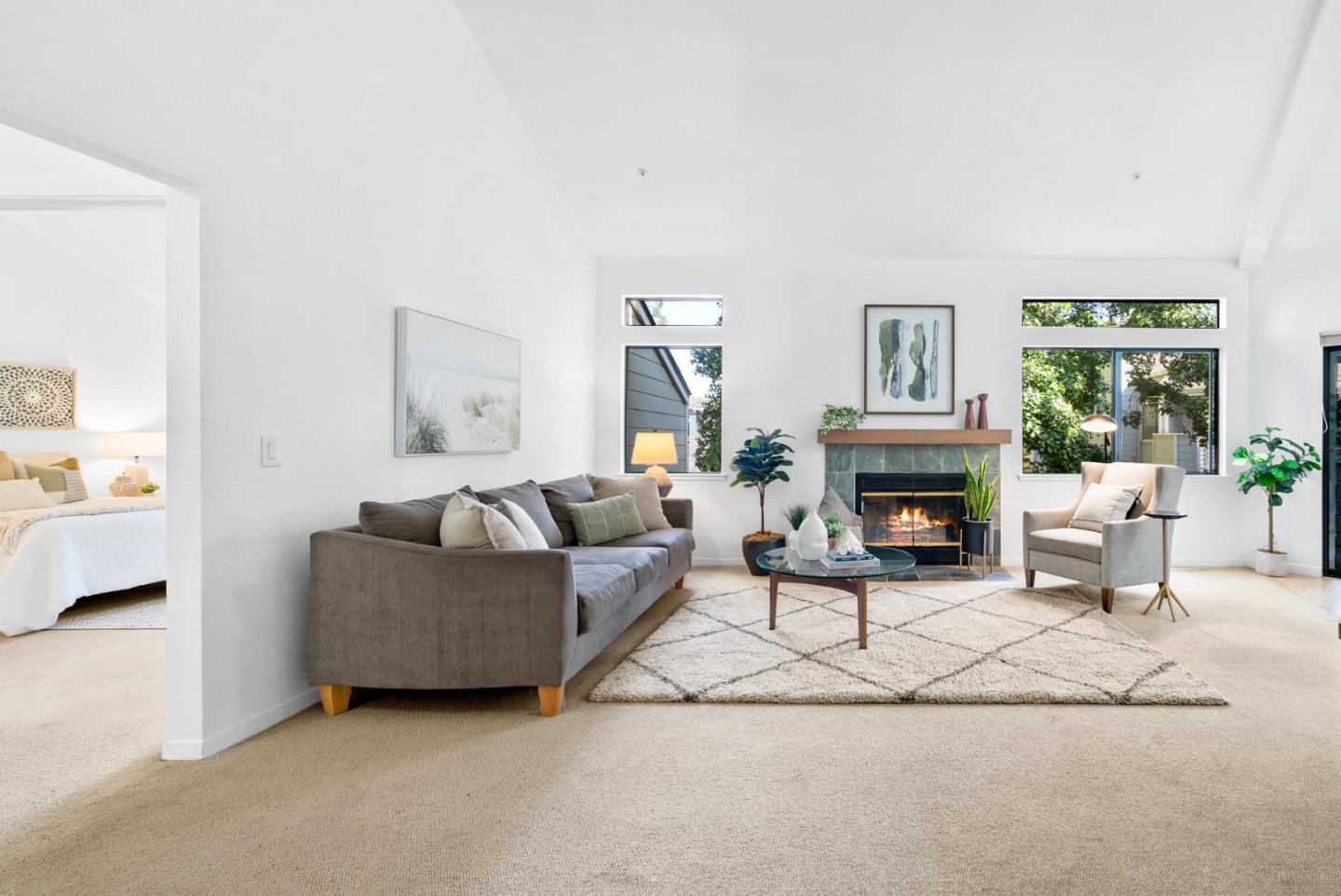 2615 Willowbrook Lane, Unit 82 Aptos, CA 95003 - Photo 3 of 27 a living room with furniture a fireplace and a potted plant