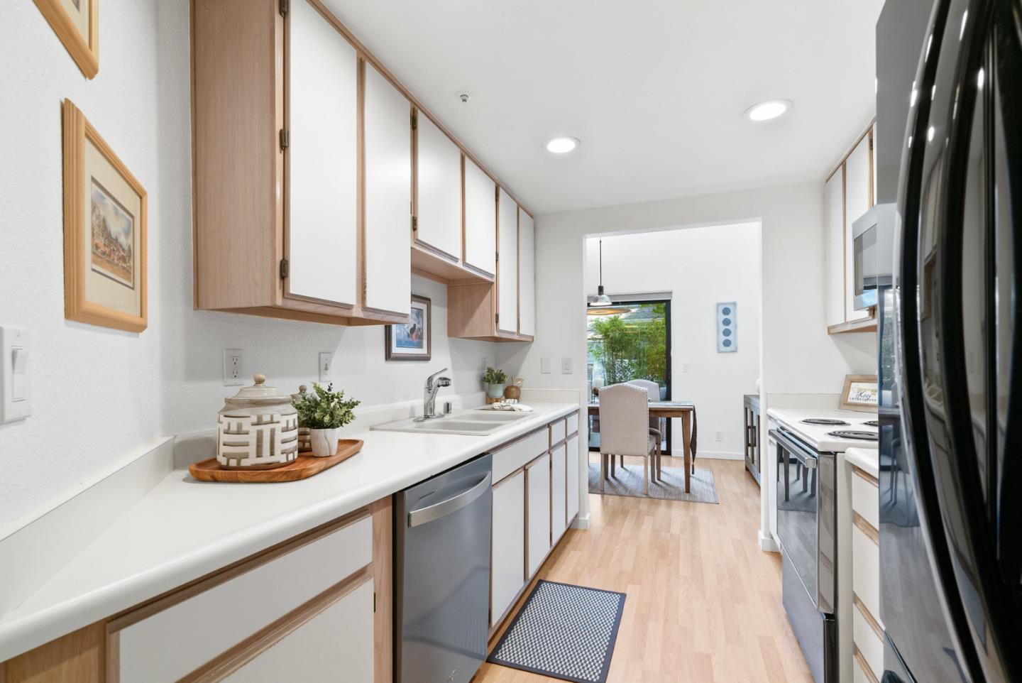 2615 Willowbrook Lane, Unit 82 Aptos, CA 95003 - Photo 8 of 27 a kitchen with a sink stove and cabinets