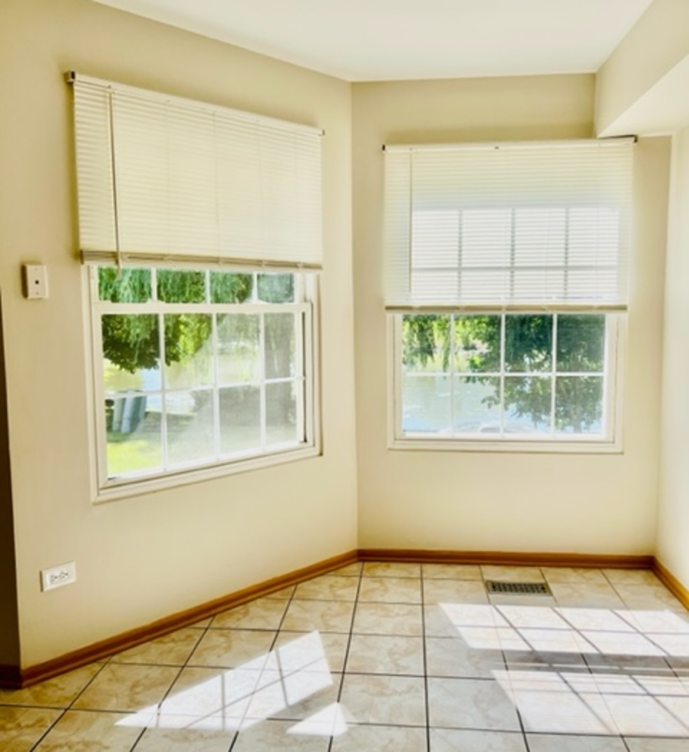 716 Sutton Circle Wheeling, IL 60090 - Photo 14 of 38 a view of an empty room with a window