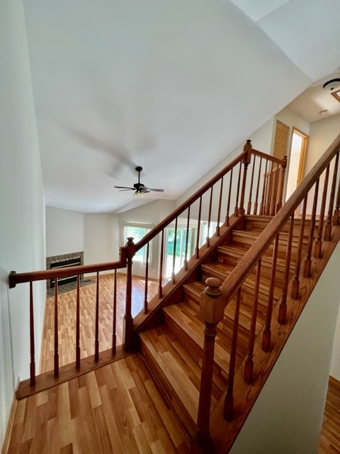 716 Sutton Circle Wheeling, IL 60090 - Photo 26 of 38 a view of staircase with wooden floor and a front door